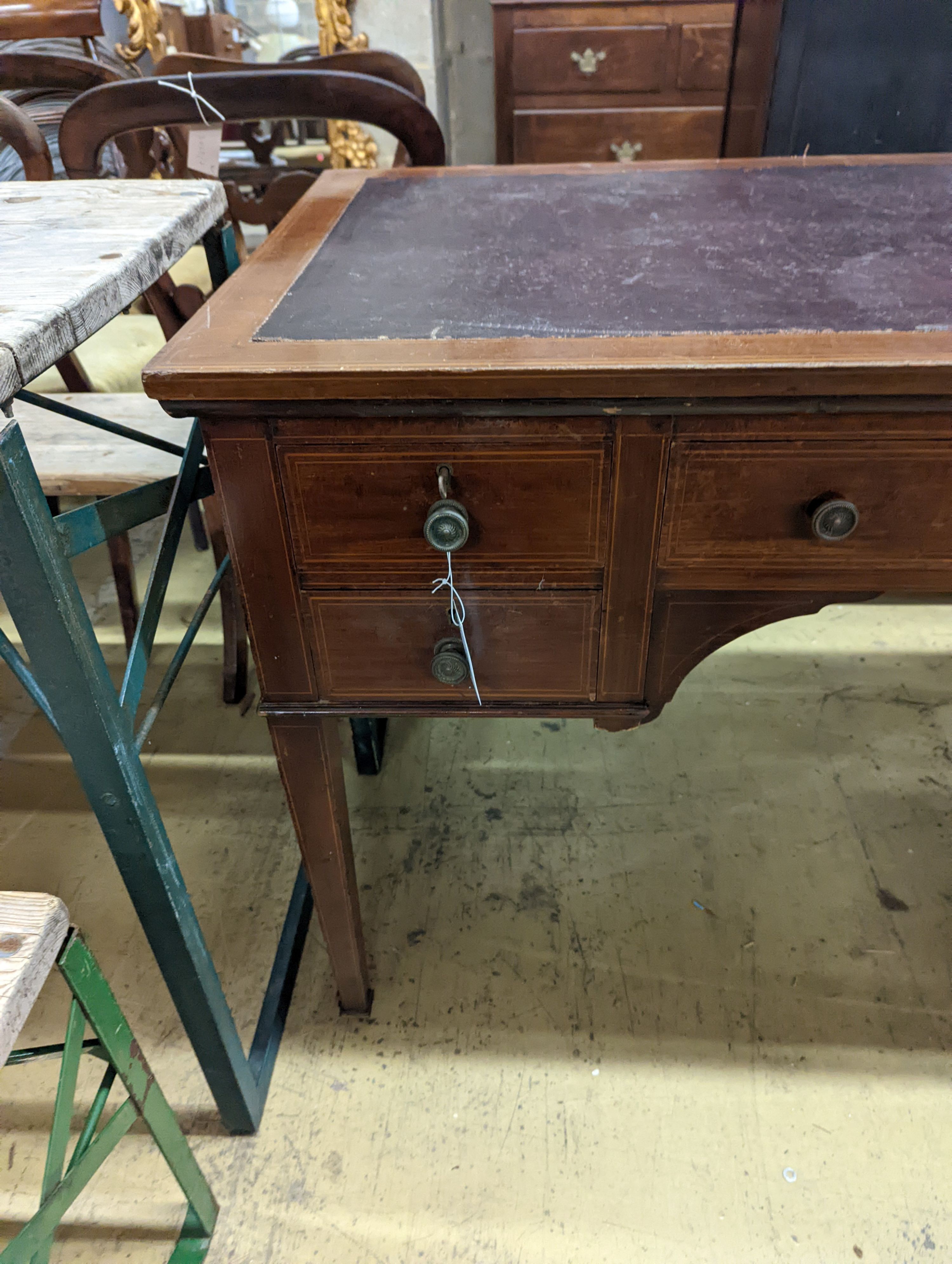 An Edwardian inlaid mahogany kneehole writing table, width 107cm, depth 60cm, height 75cm